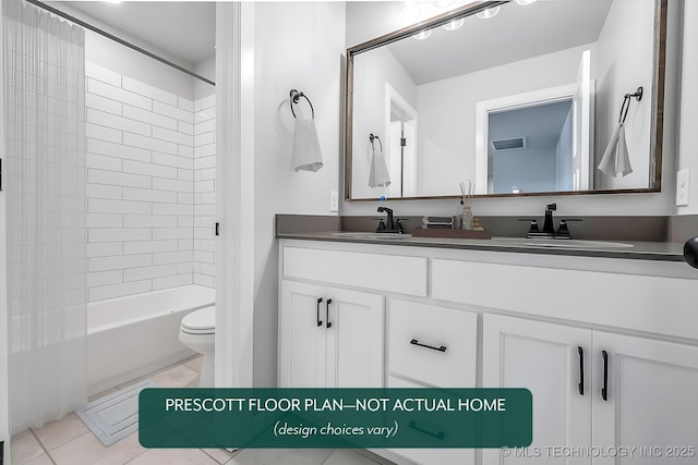 full bathroom featuring tiled shower / bath, vanity, toilet, and tile patterned flooring