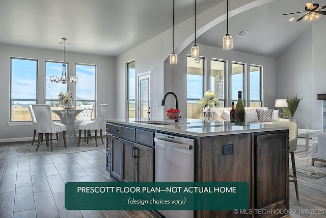 kitchen featuring pendant lighting, sink, lofted ceiling, a kitchen island with sink, and stainless steel dishwasher