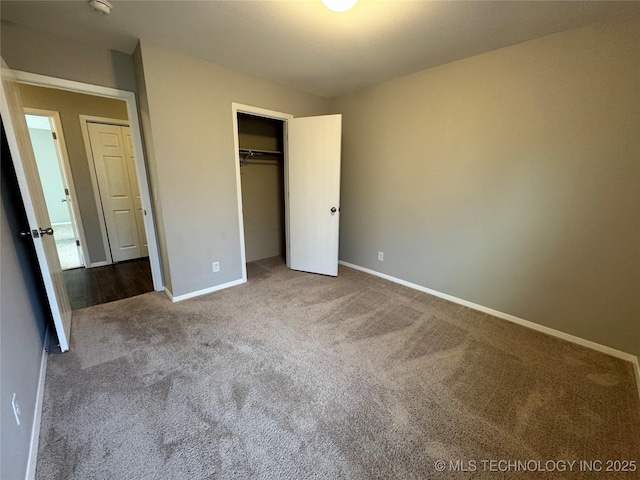 unfurnished bedroom with a closet and carpet