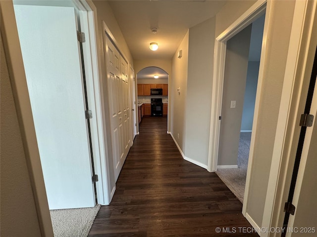 hallway featuring dark hardwood / wood-style flooring