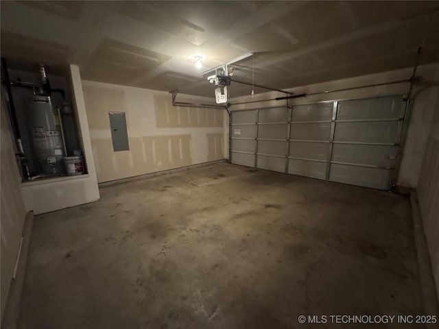 garage featuring a garage door opener, gas water heater, and electric panel