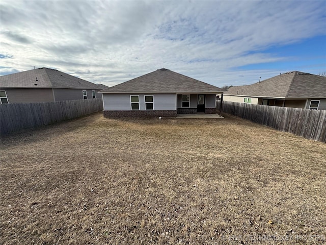 rear view of house with a lawn