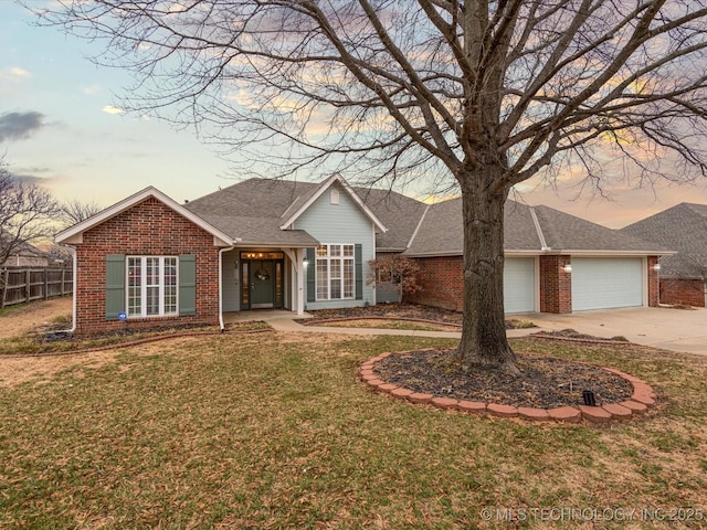 ranch-style home with brick siding, an attached garage, fence, and driveway