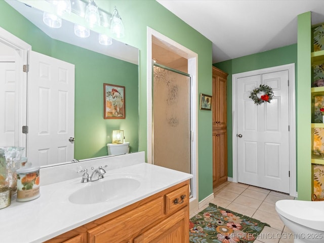 full bathroom featuring toilet, vanity, a shower stall, and tile patterned flooring