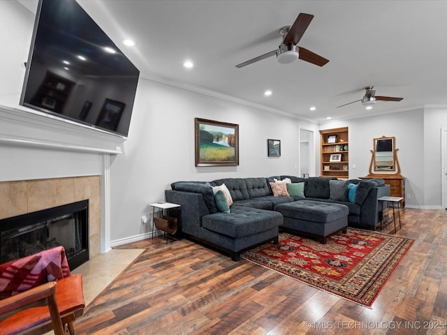 living room with ornamental molding, ceiling fan, recessed lighting, and wood finished floors