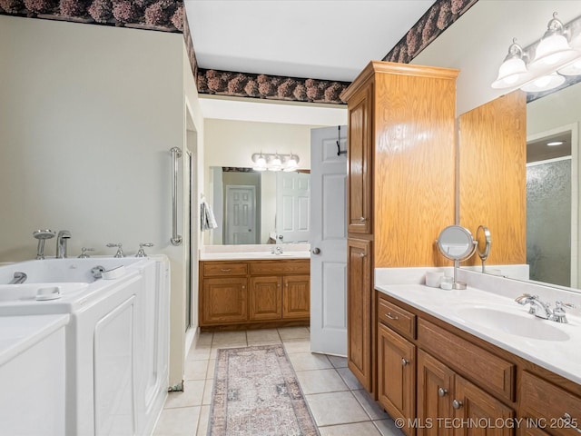 full bathroom with two vanities, tile patterned floors, a shower stall, a bath, and a sink