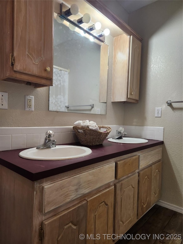 bathroom with vanity and hardwood / wood-style floors