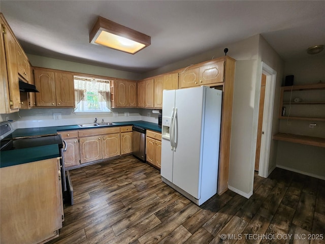 kitchen with stainless steel appliances, sink, light brown cabinetry, and dark hardwood / wood-style flooring