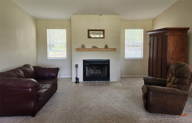 carpeted living room featuring plenty of natural light