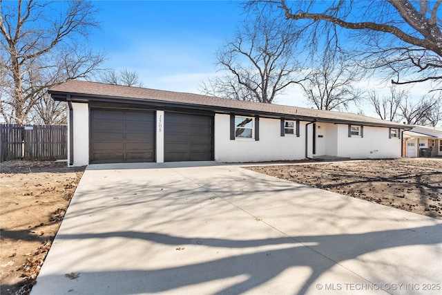 ranch-style home with a garage