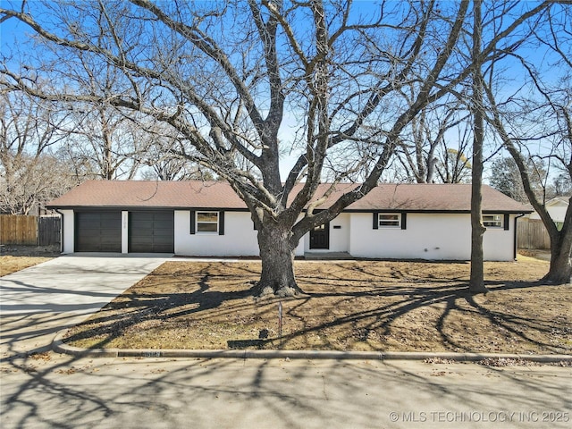 ranch-style house featuring a garage