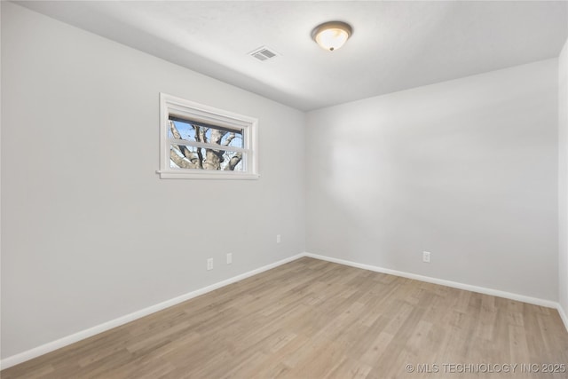 unfurnished room with light hardwood / wood-style floors