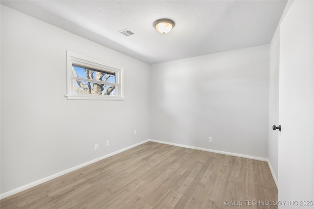 unfurnished room with light wood-type flooring