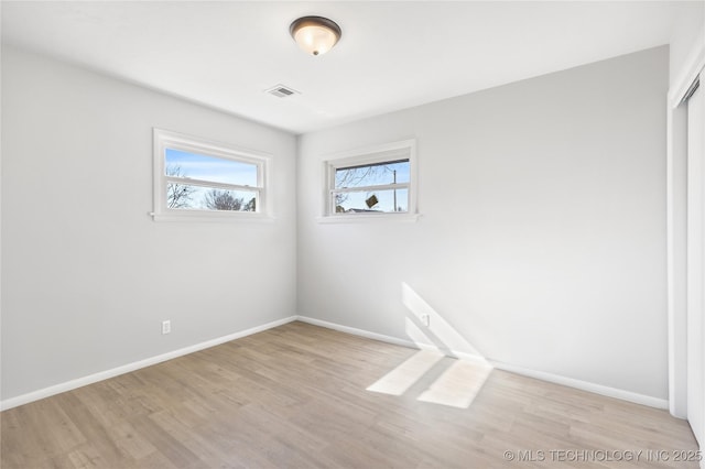 unfurnished room featuring light hardwood / wood-style flooring