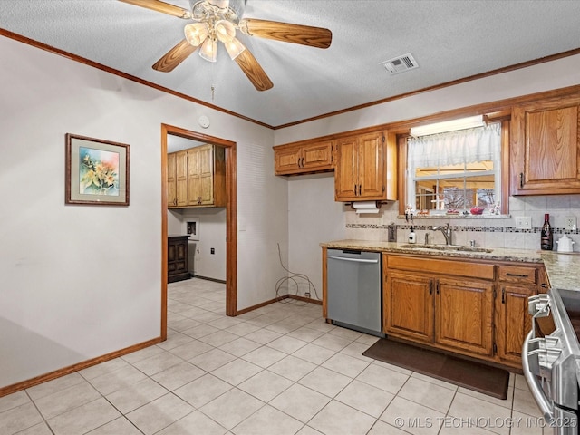 kitchen with crown molding, appliances with stainless steel finishes, sink, and backsplash