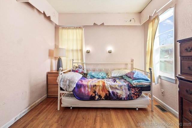 bedroom featuring light hardwood / wood-style flooring