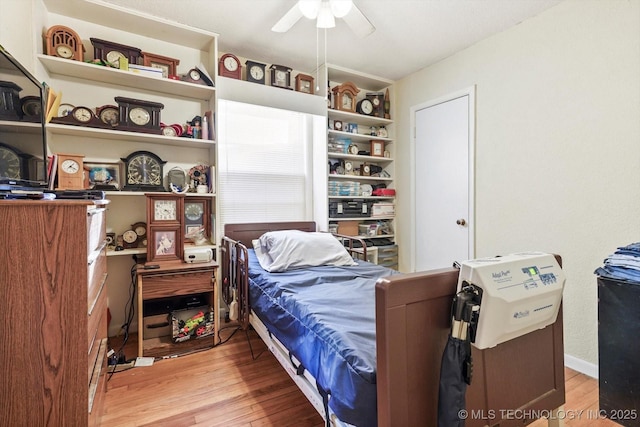 bedroom with ceiling fan and light hardwood / wood-style floors