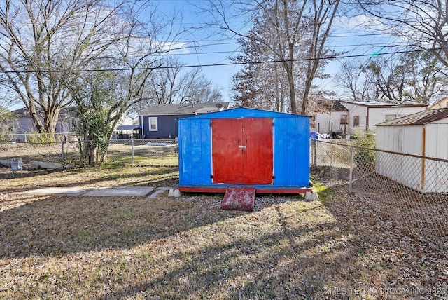 view of outdoor structure featuring a lawn