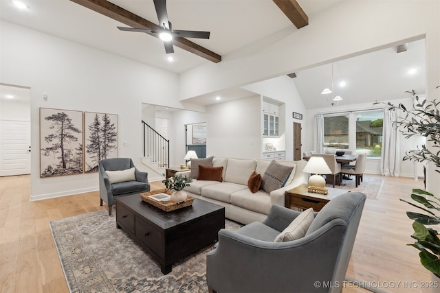 2325 E 134th Cir, Bixby, OK 74008 - living room with stairs, beam ceiling, a ceiling fan, light wood-type flooring, and high vaulted ceiling