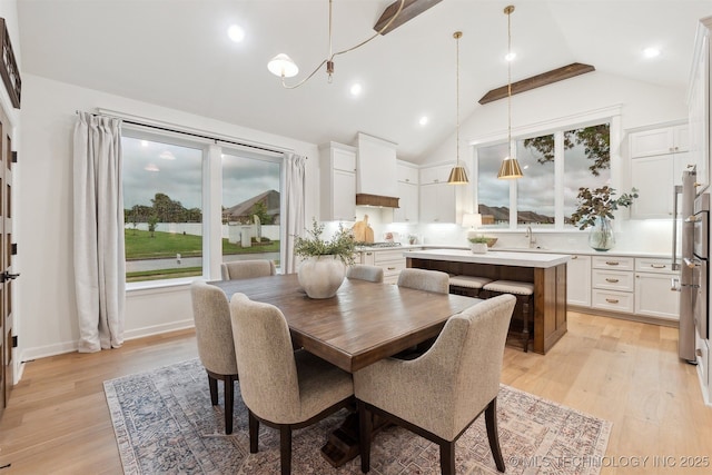 2325 E 134th Cir, Bixby, OK 74008 - dining space with light wood-style floors, a chandelier, and high vaulted ceiling