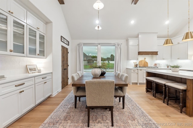 2325 E 134th Cir, Bixby, OK 74008 - dining area with high vaulted ceiling and light wood-style flooring
