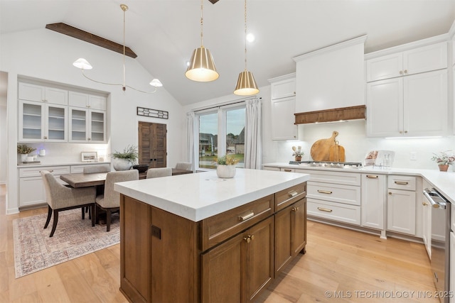 2325 E 134th Cir, Bixby, OK 74008 - kitchen featuring high vaulted ceiling, light countertops, light wood finished floors, white cabinetry, and pendant lighting