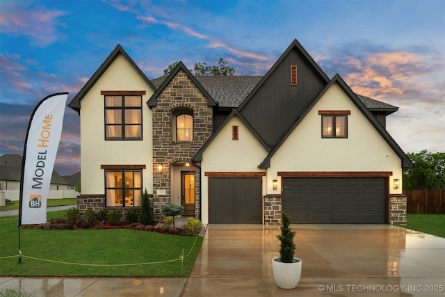 2325 E 134th Cir, Bixby, OK 74008 - view of front of house with stone siding, stucco siding, concrete driveway, roof with shingles, and a garage