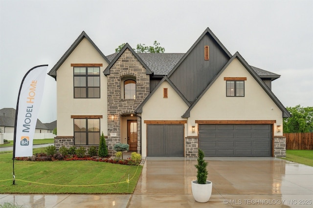 2325 E 134th Cir, Bixby, OK 74008 - view of front facade with stone siding, stucco siding, driveway, and an attached garage