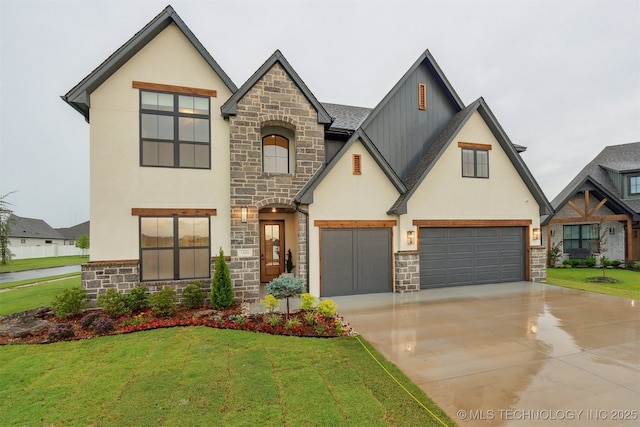 2325 E 134th Cir, Bixby, OK 74008 - view of front of home with stone siding, stucco siding, and a front lawn