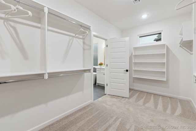 2325 E 134th Cir, Bixby, OK 74008 - walk in closet featuring carpet