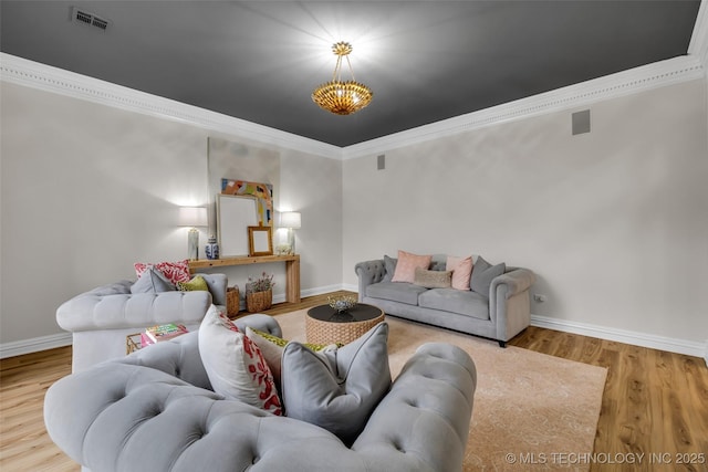 living room featuring ornamental molding and light hardwood / wood-style floors