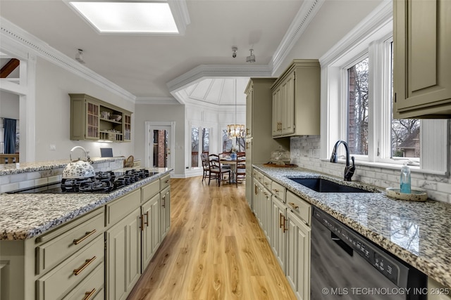 kitchen with sink, ornamental molding, light hardwood / wood-style floors, black appliances, and light stone countertops