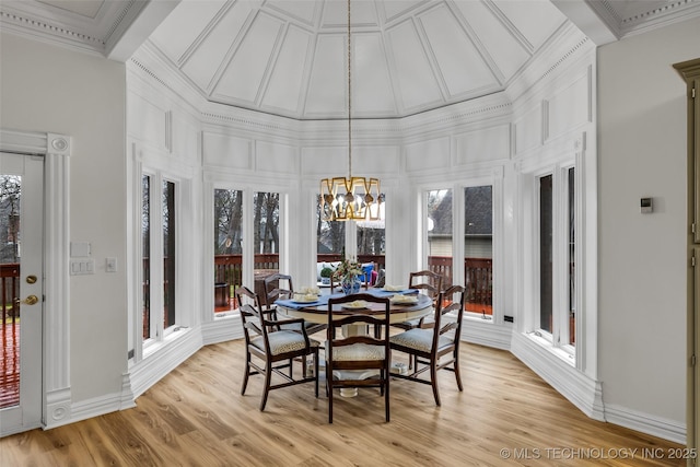 sunroom featuring coffered ceiling, a wealth of natural light, and an inviting chandelier