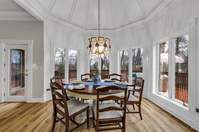 sunroom / solarium with a notable chandelier and plenty of natural light