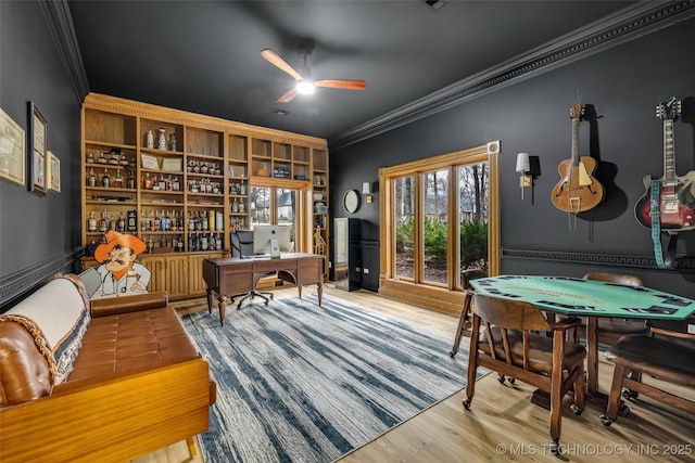 interior space featuring crown molding, ceiling fan, and hardwood / wood-style floors