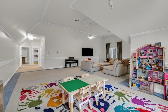 rec room featuring ornamental molding, lofted ceiling, light carpet, and ceiling fan