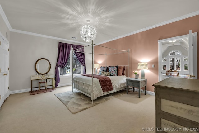 carpeted bedroom featuring crown molding and a chandelier