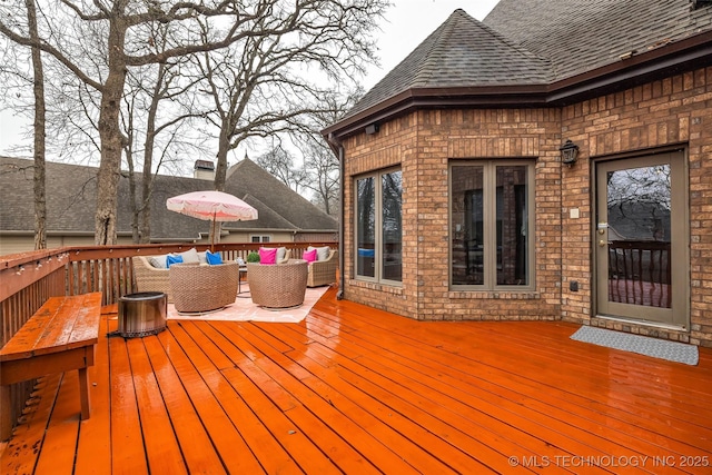 wooden deck featuring an outdoor hangout area