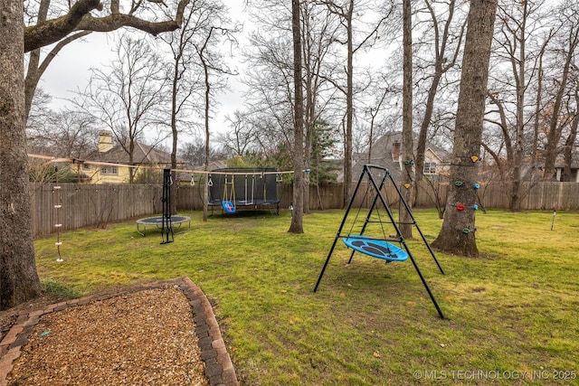 view of yard with a trampoline