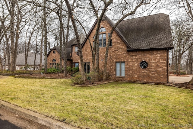 view of side of home featuring a yard