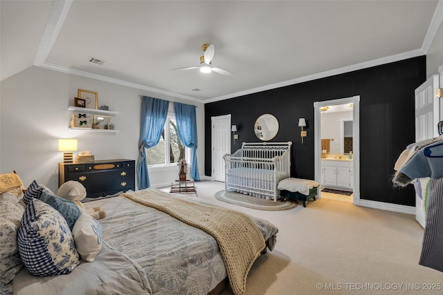 carpeted bedroom with ceiling fan, ornamental molding, and connected bathroom