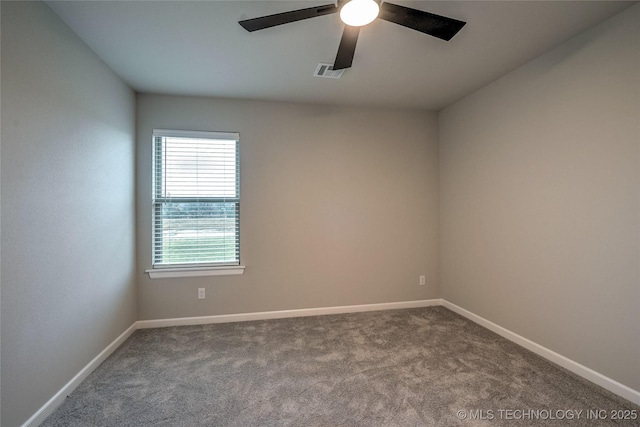 spare room featuring carpet floors and ceiling fan