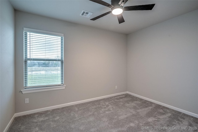 carpeted empty room featuring ceiling fan