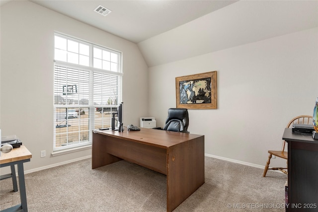 office space featuring vaulted ceiling and light carpet