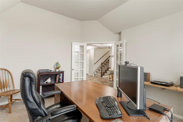 office space with french doors and lofted ceiling