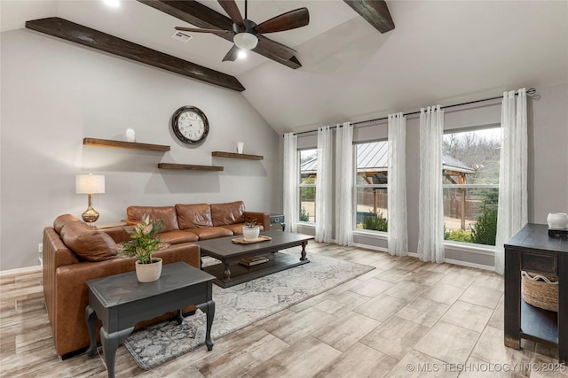 living room featuring plenty of natural light, vaulted ceiling with beams, ceiling fan, and light hardwood / wood-style floors