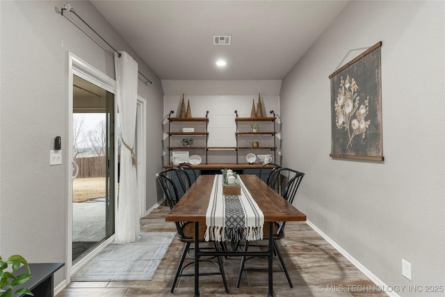 dining area with dark wood-type flooring