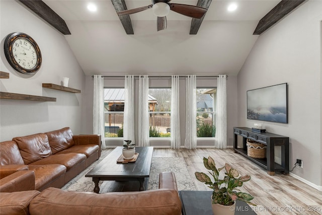 living room with lofted ceiling with beams, ceiling fan, and light hardwood / wood-style flooring