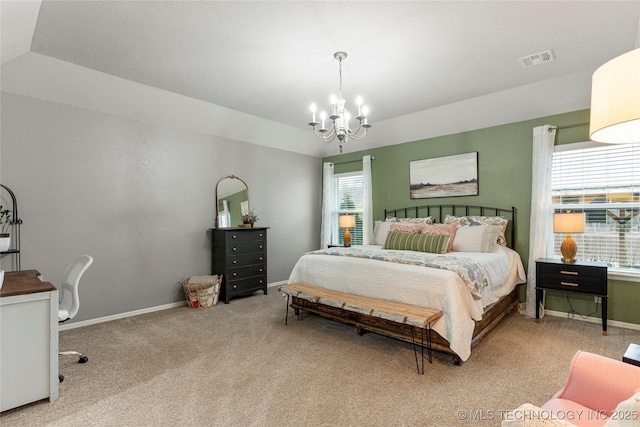 carpeted bedroom with lofted ceiling and a chandelier