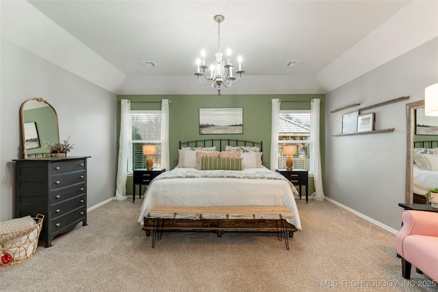 bedroom featuring an inviting chandelier, vaulted ceiling, and light carpet